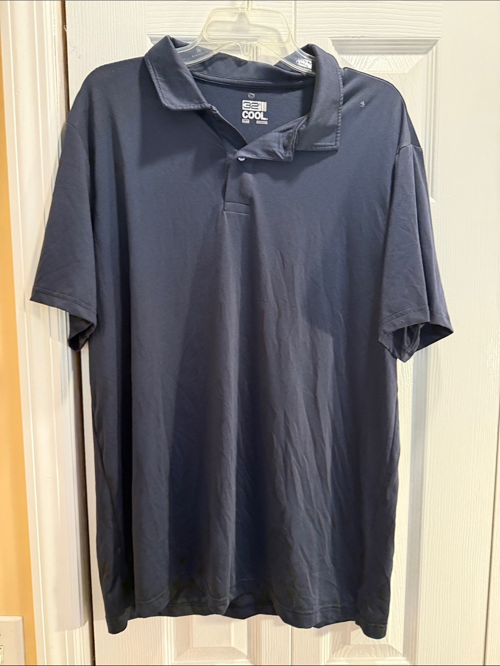 Men's Cool-Tech Navy Polo Shirt- call-of: glue on left shoulder-as seen in pic